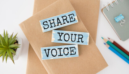 Share Your Voice text on a wooden cubes