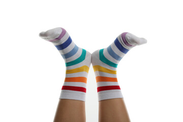 Female legs in rainbow socks isolated on white background