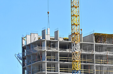 Crane and highrise construction site