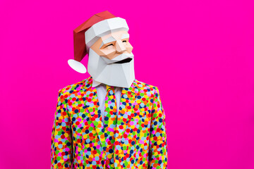 Man with funny low poly Santa Claus mask on colored background