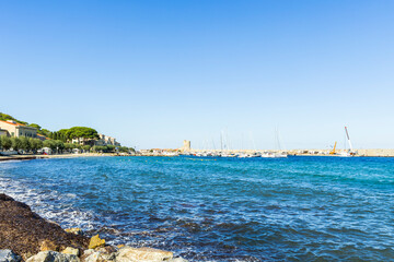 Fototapeta premium View over the beach and houses and hills of Marciana Marina on the coast of the island of Elba