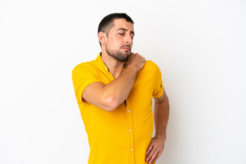 Young handsome caucasian man isolated on white background suffering from pain in shoulder for having made an effort