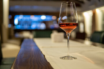 glass of wine on an empty table