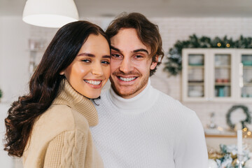 Happy couple celebrating Christmas at home