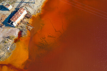 Red water due to toxic emissions from the mining and processing plant.