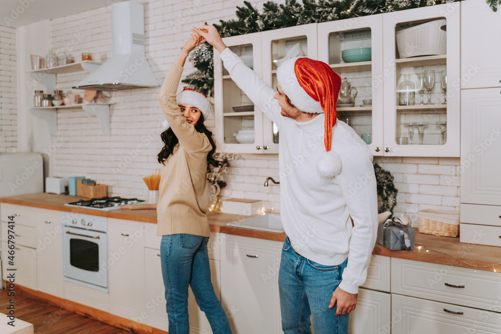 Wall mural happy couple celebrating christmas at home