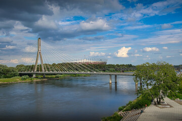 Warsaw - view of the Vistula river. In the background the Swietokrzyski Bridge and PGE Narodowy Stadium