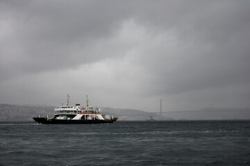 Fototapeta na wymiar passenger ferry crosses the Bosporus strait in Istanbul, Turkey in stormy and rainy day