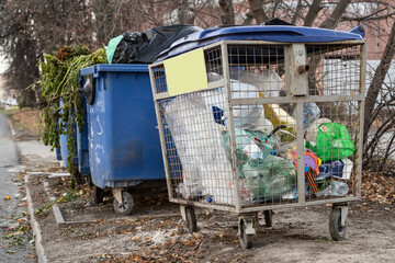 Naklejka premium Separate collection of garbage in containers on a city street for recycling and recycling of plastic