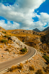 Winding mountain road on a cloudy day