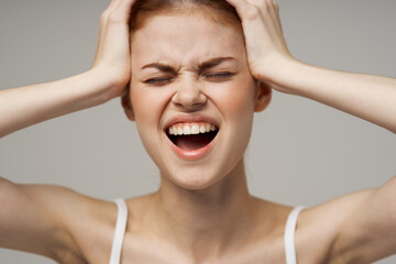 disgruntled woman headache health problems stress studio treatment