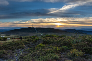 Day and Night with a crescent moon at the end of summer in the mountains of Asturias, with horses and a sunset of color!