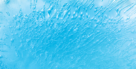 Fototapeta na wymiar Macro view ice floe pattern texture with frozen air bubbles, small abstract details. Shallow depth of field.
