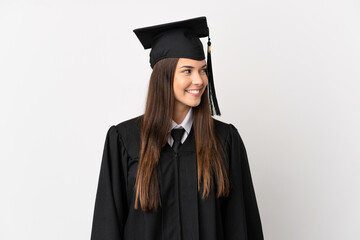 Teenager Brazilian university graduate over isolated white background looking side