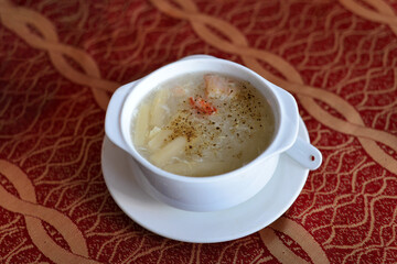 hai Dishes - Soup made from Coco Milk and Mushrooms and Chicken Meat. Creamy soup with chicken and vegetables. Vegetable cream soup with shrimps and croutons in bowl. 