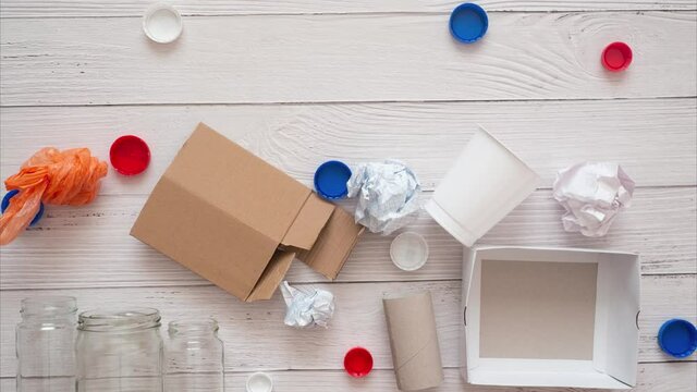 Separate collection and sorting of garbage at home. Glass and plastic and paper for recycling. Time lapse