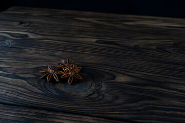 Anais stars on a dark brown wooden background