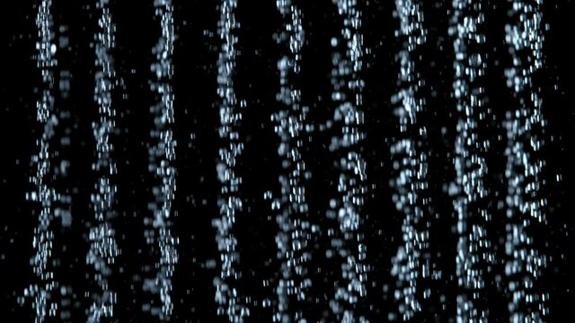 Super Slow Motion Shot of Shower Water Stream Falling on Black Background at 1000fps.