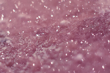 Beautiful druse of natural pink mineral amethyst close-up. Semiprecious stone background. Gem...