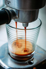 coffee maker pouring espresso