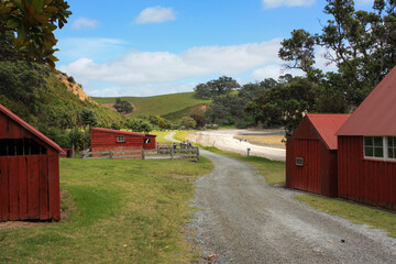 Historic farm buildings at Scandrett national park, a safe and shallow swimming beach, walking tracks, located on the north east tip of the Mahurangi Peninsula, north of the city of Auckland, Matakana