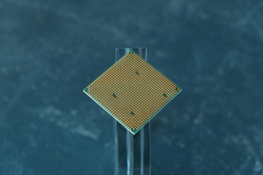 computer processor on a glass stand. On a gray background