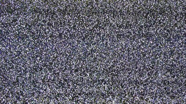 Close up view at a plasma tv while showing television activity.