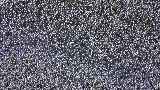 Close up view at a plasma tv while showing television activity.