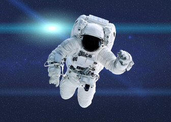 Space astronaut in outer space with lens flare. Science fiction wallpeper. Elements of this illustration were furnished by NASA.