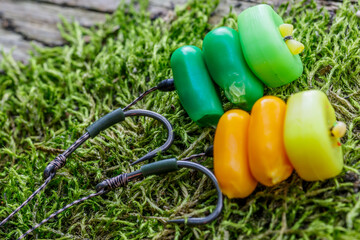 Carp fishing chod rig.The Source Boilies with fishing hook. Fishing rig for carps,Carp boilies, corn, tiger nuts and hemp.Carp fishing food boilies.