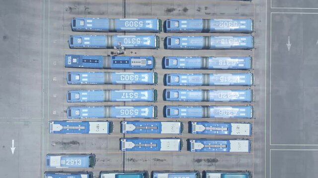 Aerial view Los Angeles bus terminal depot. Public transportation bus hub in LA. Transfer station, commuter life in American city. 