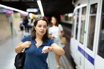 Hurrying woman is late for subway train