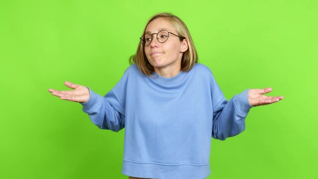 Young blonde girl with glasses and having doubts. Green screen chroma key