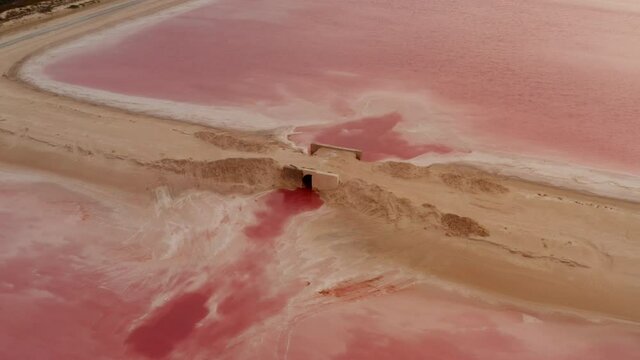 Aerial view of culvert between two pink lakes. Strange colour of water coloured by specific microorganisms. Las Coloradas, Yucatan, Mexico