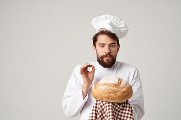 male cook with bread in hand Professional emotions