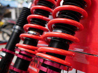 red shock absorbers of car at garage.