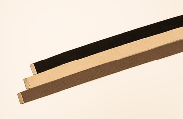 Three colorful canvas belts shot isolated against a white background. 