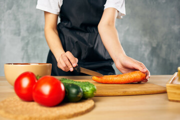 Woman in black apron Cooking healthy eating salad diet