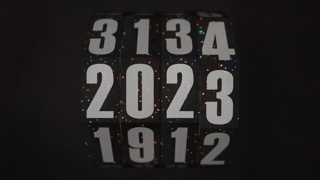 Vintage Christmas rotating counter blinking lights switches from 2021 to 2026 on dark textured background