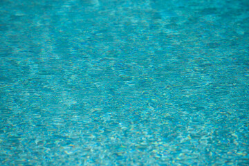 Tansparent clear calm water surface texture. Abstract nature background. Sea water pattern.