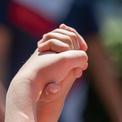 Children are holding hands. Friendship and love.