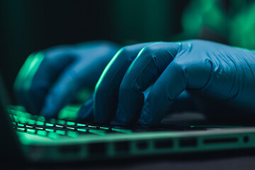Close up hands Hackers. Hacking to steal important information. Use a computer to release malware...