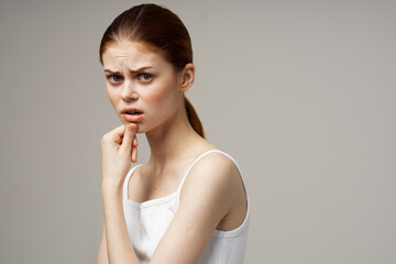 woman in white t-shirt toothache health problems disorder light background