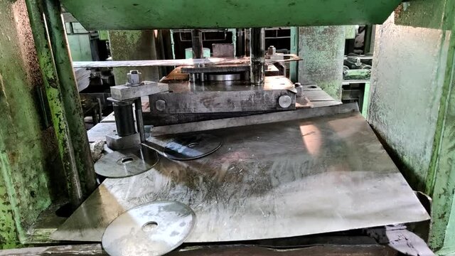 process oldschool industial sheet steel planchet operation out of steel sheet stripe