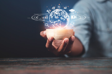 Business man wearing a suit using a tablet hand presenting cyber business world graphics In the business technology model, the concept of digital business processing