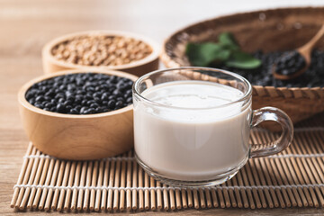Black soy bean seeds and soy milk in a cup glass, Healthy drink