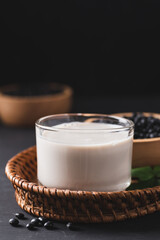 Black soy bean seeds and soy milk in a cup glass, Healthy drink