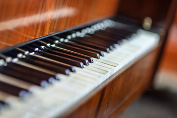 Close-up of the fingerboard of a brown grand piano