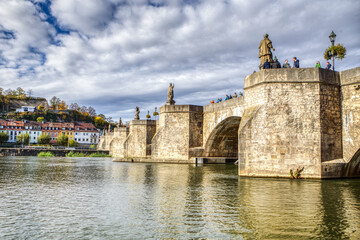 Fototapeta na wymiar Alte Mainbrücke, Old Main Bridge across the river Main in Würzburg, bavaria