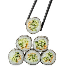 Chopsticks with tasty maki rolls on white background